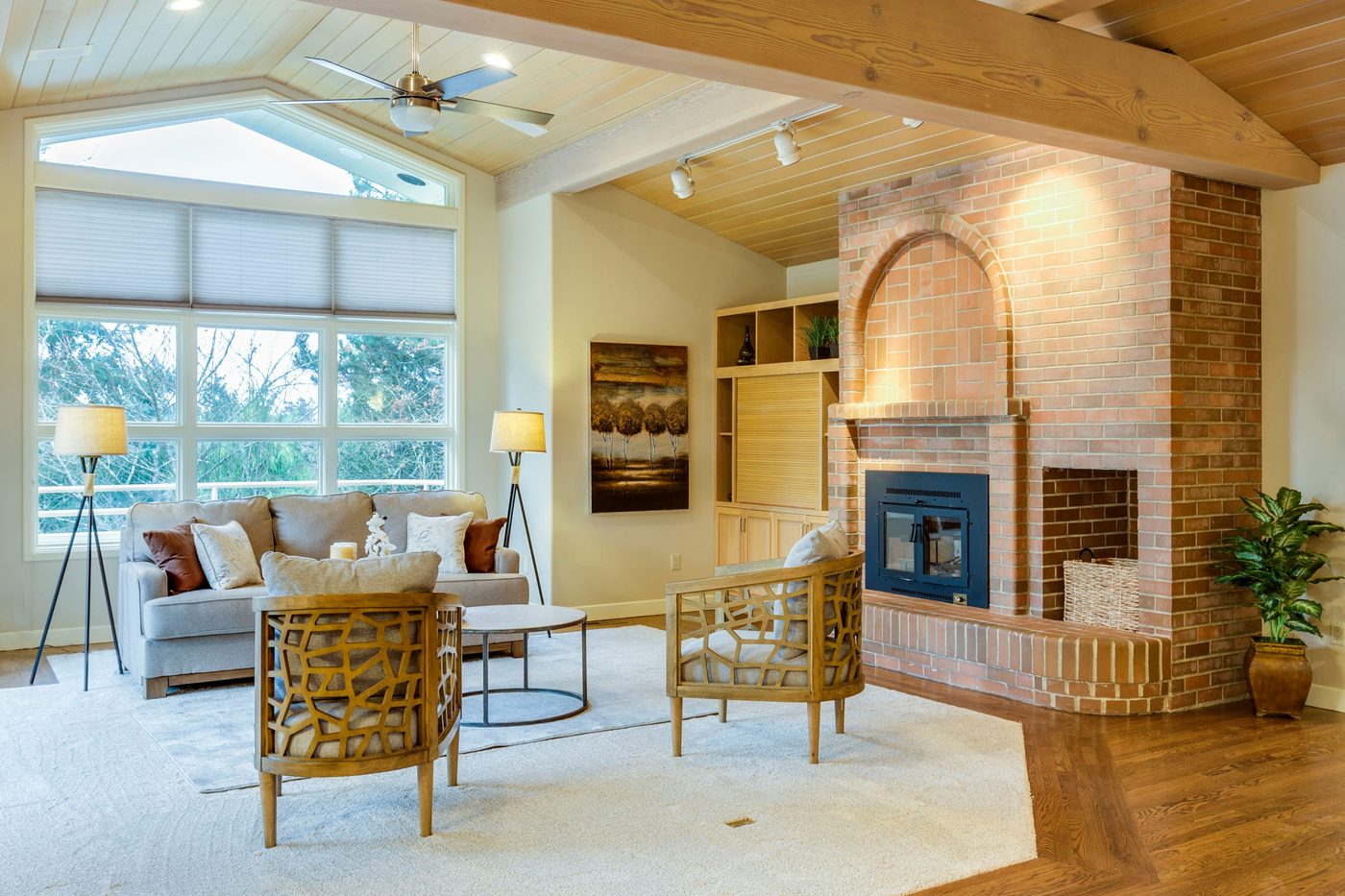 Living room addition with wood ceiling, exposed beam, and brick fireplace